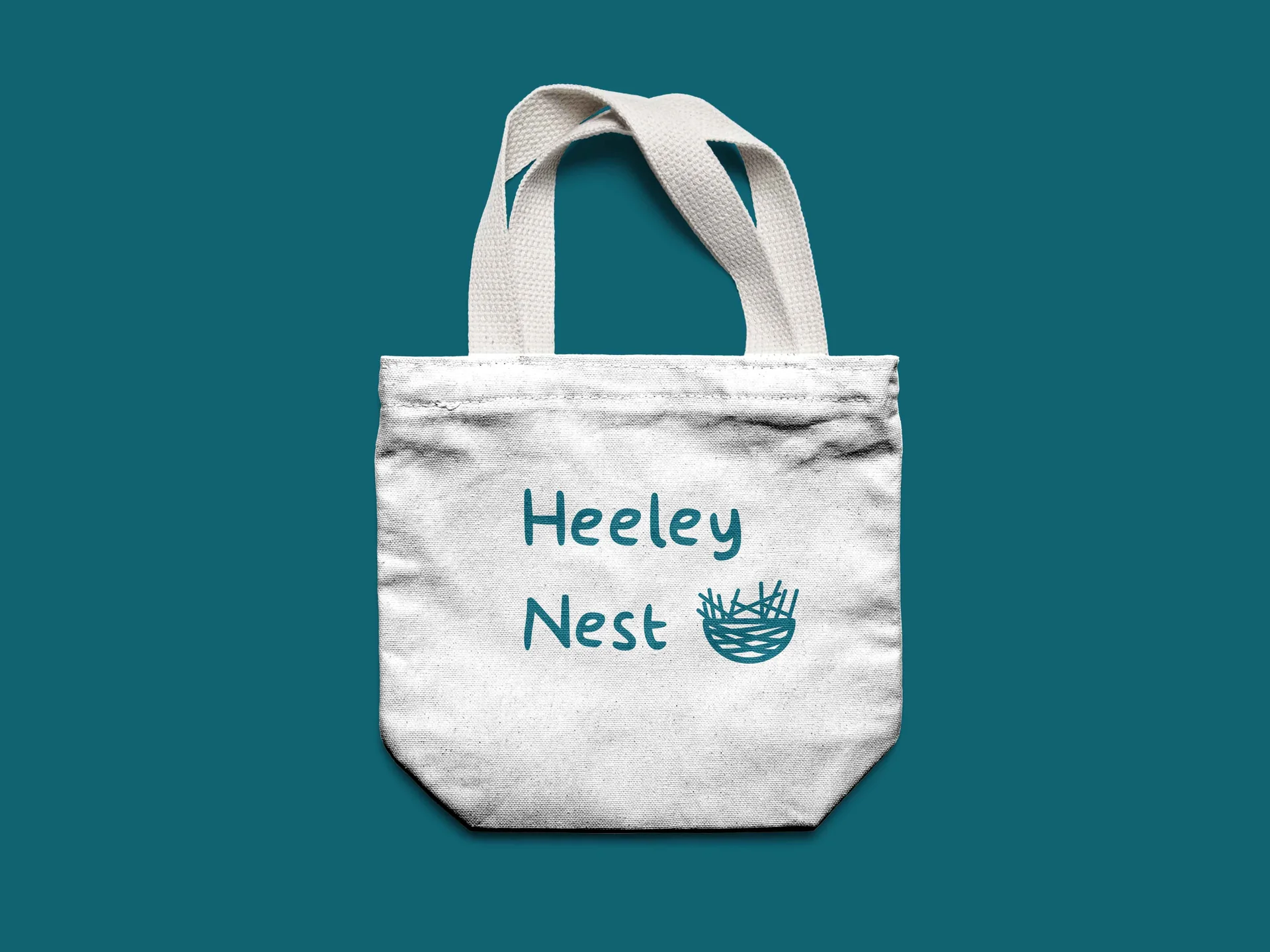 Heeley Nest logo applied to a white tote bag
