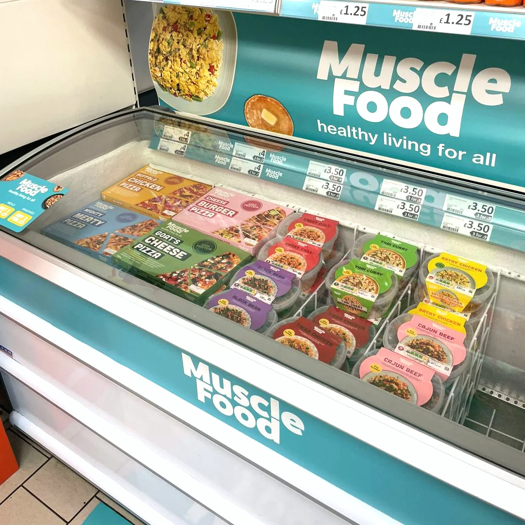 MuscleFood branded freezer surround and sticker graphics in a Heron store